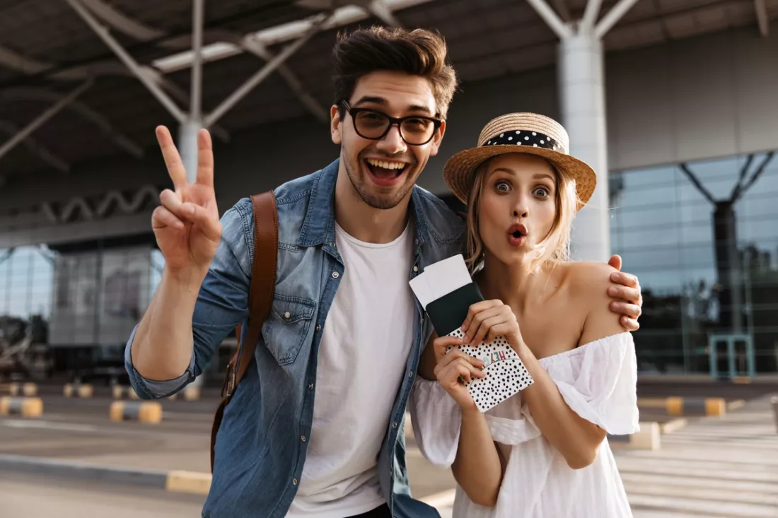 Two young travellers with passports and tickets